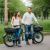 Happy couple with electric bikes